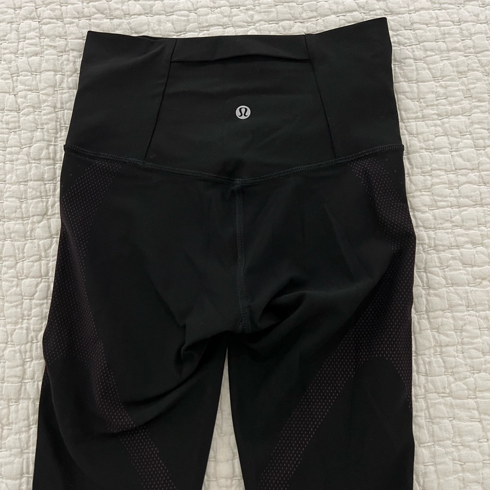 LuLu size 4, long leggings with pocket and pink decor